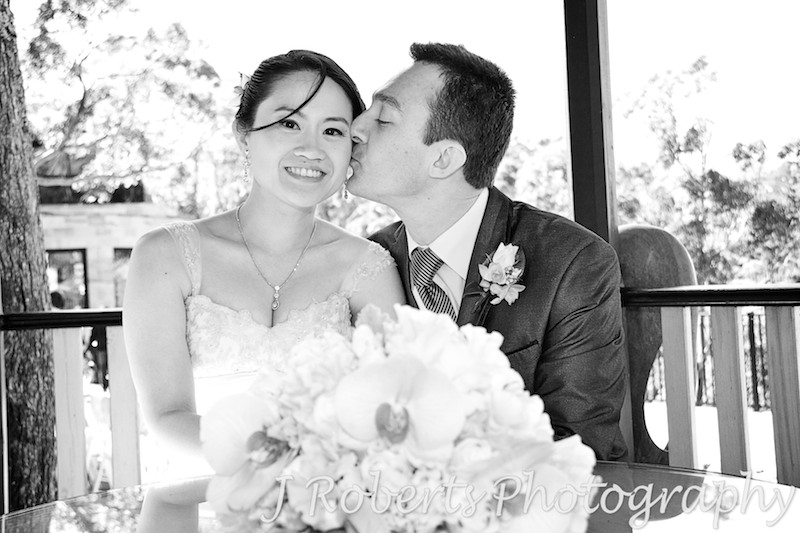 Groom kissing bride - wedding photography sydney